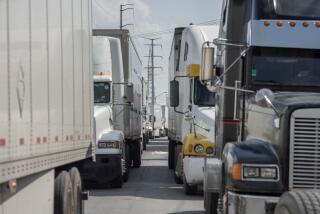 Semi-trucks wait for inspection at the Zaragoza International Bridge, in Juarez, Mexico.