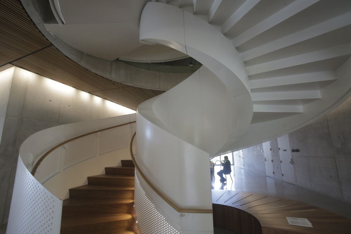 A spiral staircase is featured near the center of the new Franklin Antonio Hall.