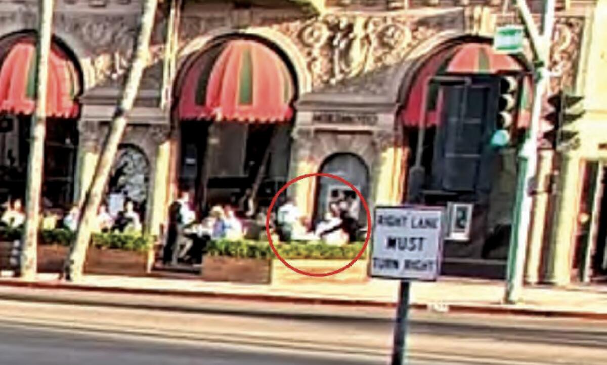 Street cameras on Wilshire Boulevard and Rodeo Drive captured two suspects holding a man at gunpoint and stealing a $1M watch