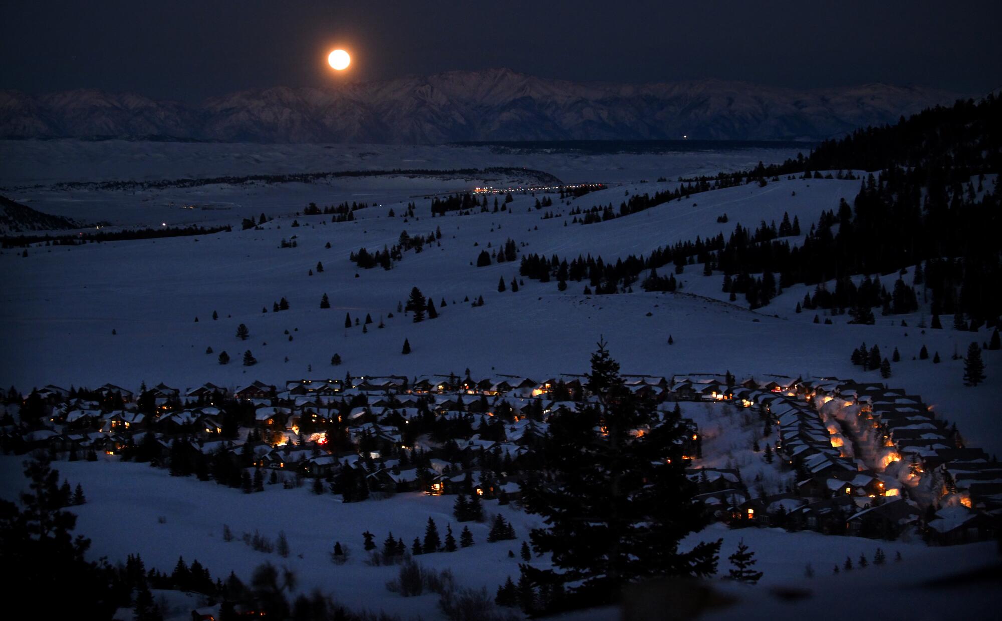 A full moon rises over Mammoth Mountain on Tuesday.
