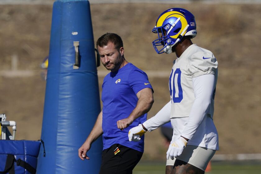 Los Angeles Rams outside linebacker Von Miller, right, walks on the field with coach Sean McVay during NFL football practice Wednesday, Nov. 3, 2021, in Thousand Oaks, Calif. (AP Photo/Marcio Jose Sanchez)