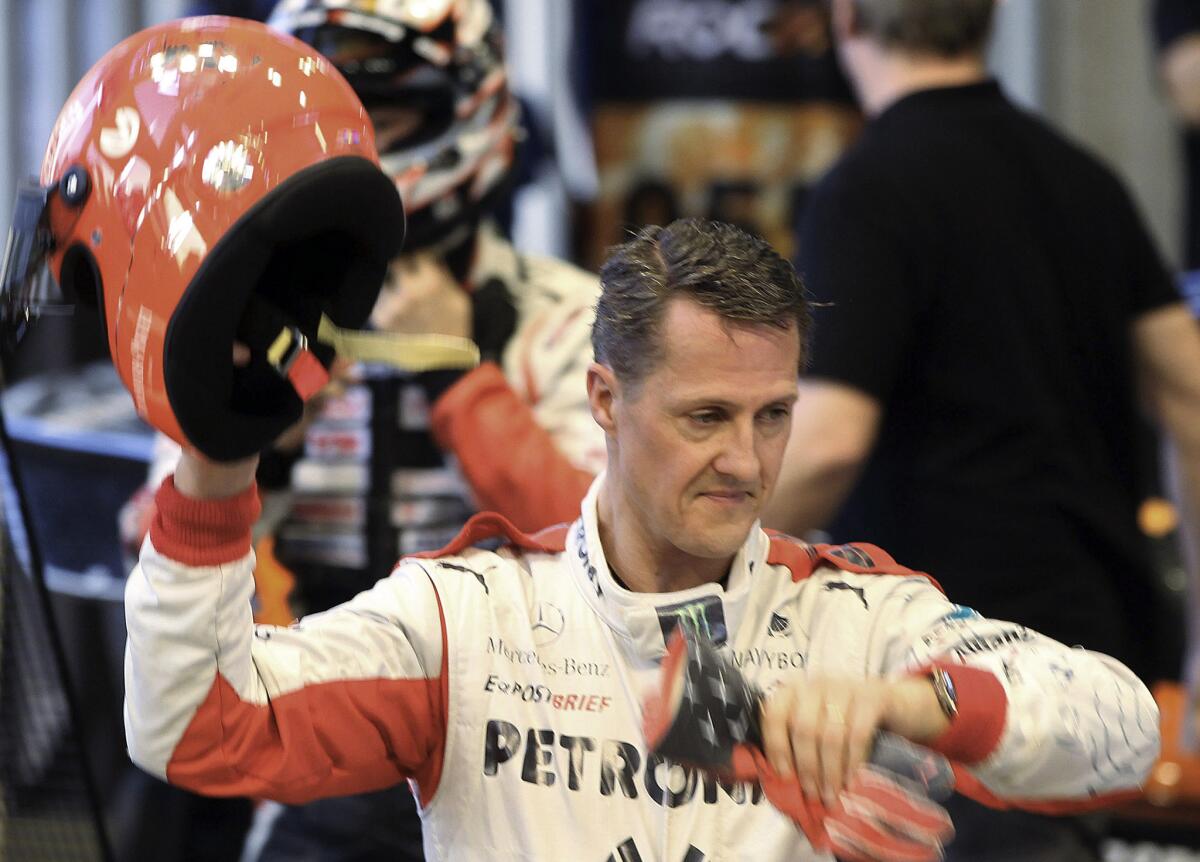 Michael Schumacher, shown in 2012, "is not in a coma anymore," media reports quoted his manager, Sabine Kehm, as saying in a brief statement Monday.