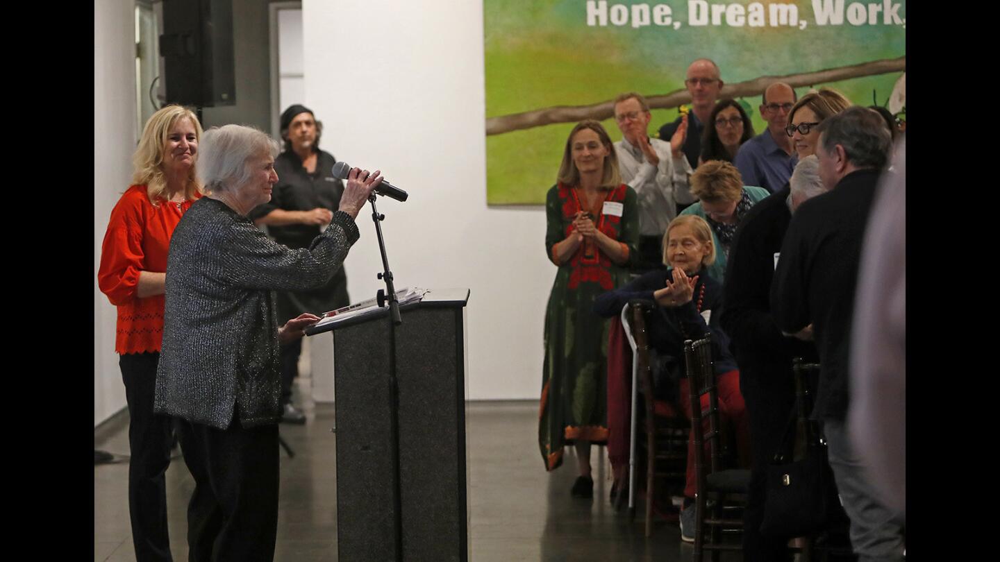 Jean Forbath, board emeritus and a founding board member, is greeted by a standing ovation before speaking during the 10th Annual SOY (Save Our Youth) Fiesta in celebration of the organization's 25th Anniversary.