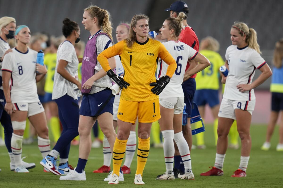 Alyssa Naeher stands with hands on her hips after a U.S. women's soccer loss at the Tokyo Olympics.