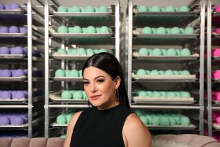 LOS ANGELES, CA-SEPTEMBER 24, 2019: Olivia Alexander, founder and CEO of Kush Queen poses for a portrait by racks of bath bombs made with pure CBD at her headquarters on September 24, 2019 in Anaheim, California. The Kush Queen brand sells both CBD-only and THC-infused products. (Photo By Dania Maxwell / Los Angeles Times)