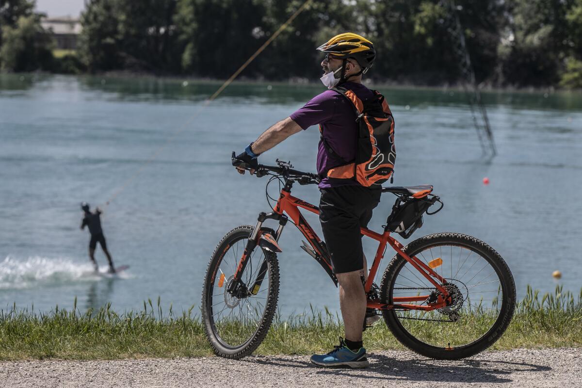 People enjoy the Idroscalo reservoir in Milan, Italy, on May 9 as nationwide lockdown measures to prevent the spread of the coronavirus were relaxed.