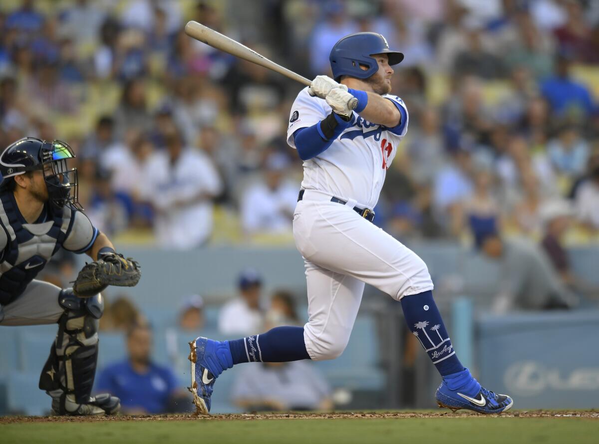 Dodgers third baseman Max Muncy hits a two-run double.