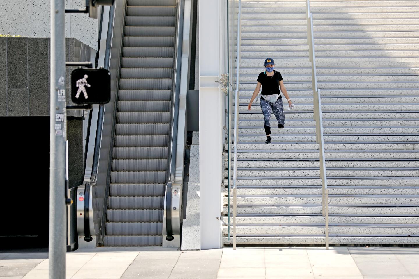 Chrystabelle Ramirez of Los Angeles gets in her workout on the Terri and Jerry Kohl Staircase at the Music Center in downtown Los Angeles.