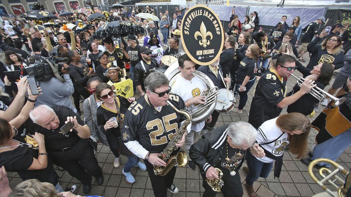The Storyville Jazz Band leads a jazz funeral for the Saints' season on Feb. 3.