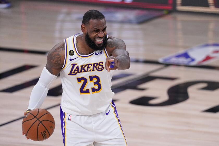 Lakers forward LeBron James directs the offense against the Rockets during Game 5 on Sept. 12, 2020.