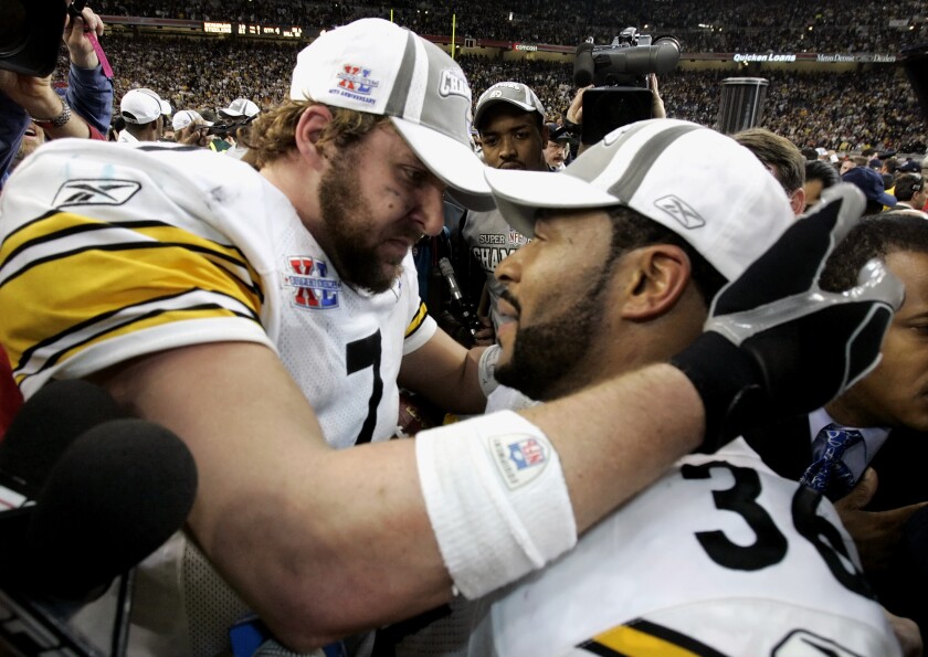 FILE - Pittsburgh Steelers quarterback Ben Roethlisberger, left, and Jerome Bettis celebrate after the Steelers' 21-10 win over the Seattle Seahawks in the Super Bowl XL football game Sunday, Feb. 5, 2006, in Detroit. The Steelers are hoping to send Roethlisberger out the way Roethlisberger and company sent out Bettis in the 2005 playoffs, with a Super Bowl win. The seventh-seeded Steelers open the playoffs on Sunday, Jan. 16, 2022, at AFC West champion Kansas City. (AP Photo/Gene J. Puskar, File)