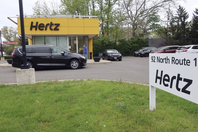 FILE - In this May 6, 2020, file photo, a Hertz car rental is closed during the coronavirus pandemic in Paramus, N.J. Hertz filed for bankruptcy protection Friday, May 22, 2020, unable to withstand the pandemic that has crippled global travel and with it, the heavily indebted 102-year-old car rental company's business. (AP Photo/Ted Shaffrey, File)
