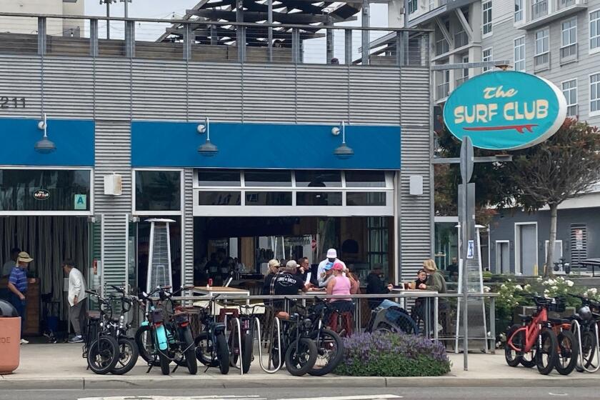 The Surf Club opened Friday under new owners in the former location of the Hello Betty restaurant.