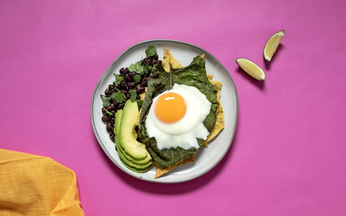 A sunny-side-up egg atop chilaquiles verdes