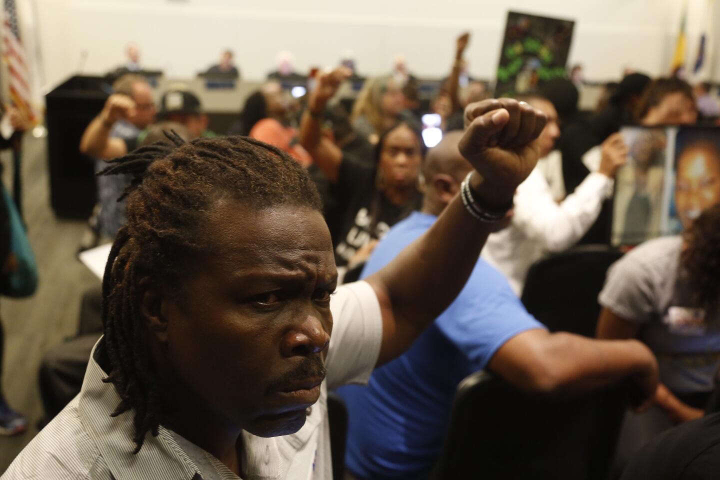 Protesters attend police commission meeting