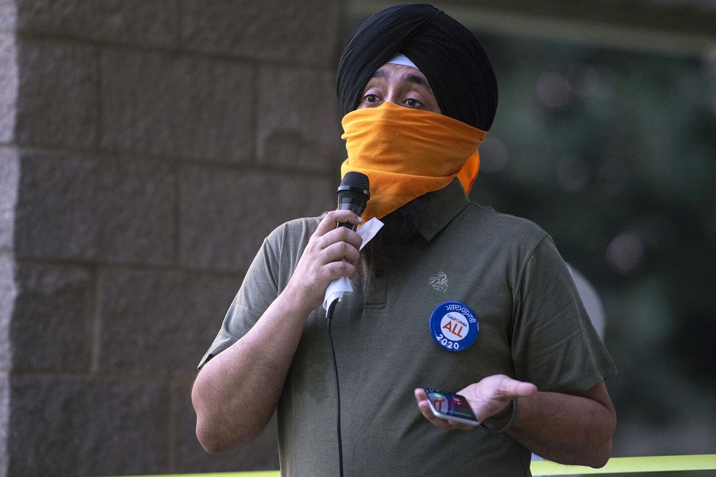 Deep Singh speaks during the vigil.