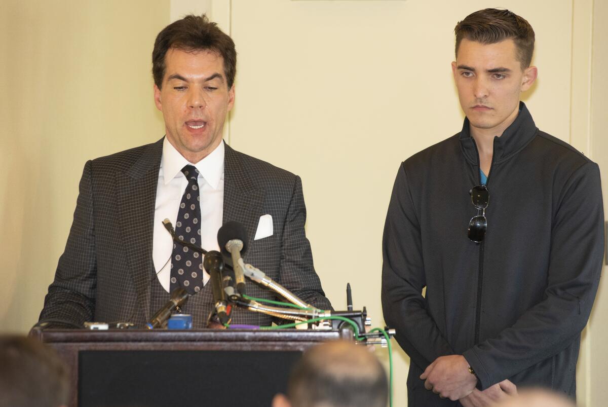  Jacob Wohl, right, and his attorney Jack Burkman