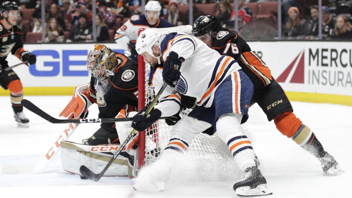 Ducks goaltender John Gibson stops a shot by Edmonton's Zack Kassian during the first period Sunday.