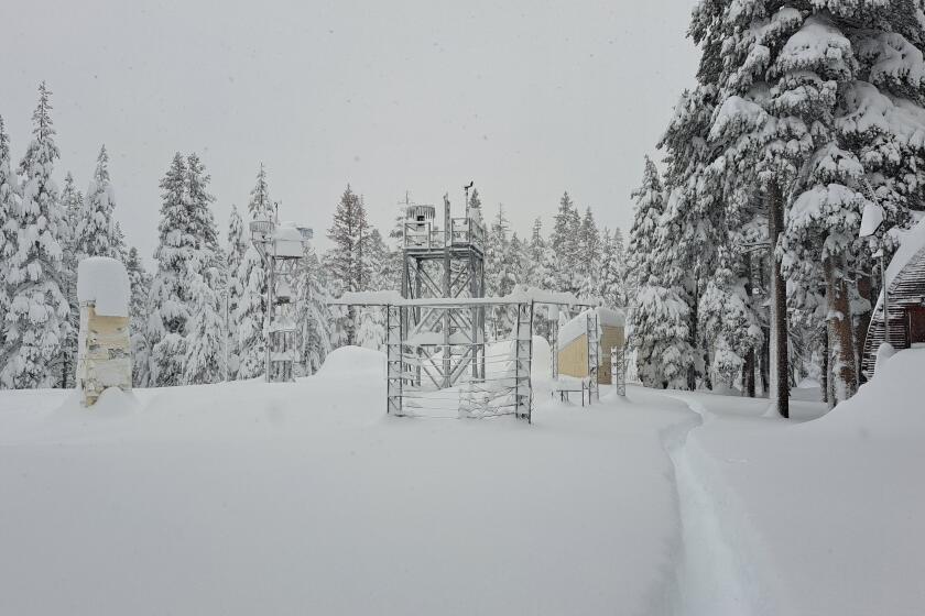 Snow blankets the area around the Central Sierra Snow Lab in Soda Springs, CA.