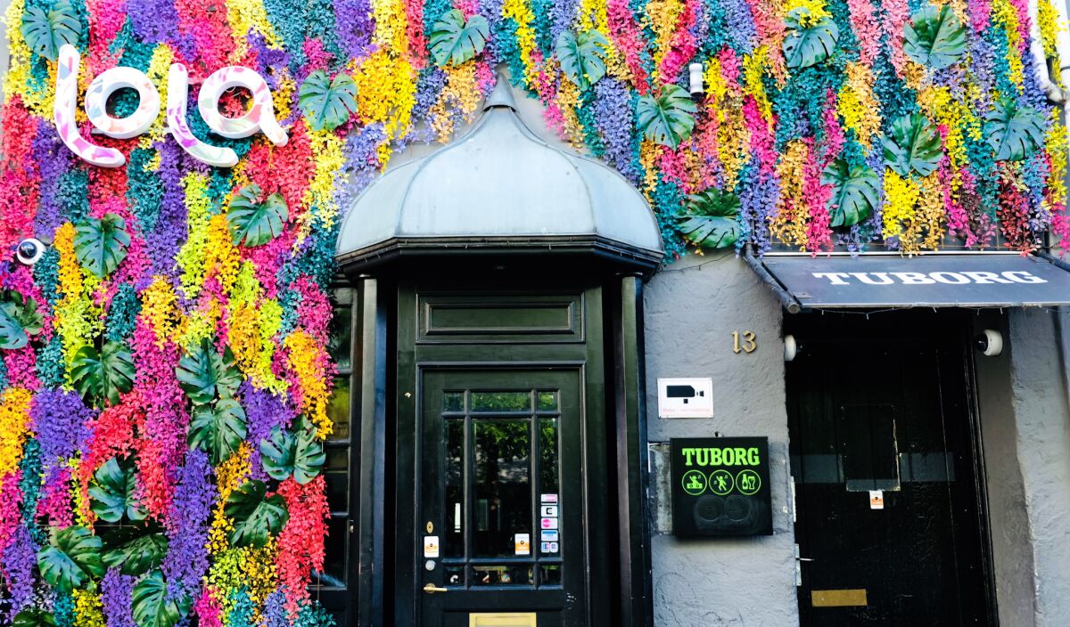 A living wall with the words “Lola” marks the start of a curative tour across Scandinavia.