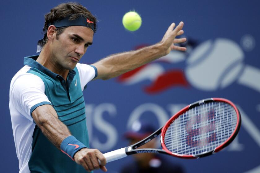 Roger Federer returns to Leonardo Mayer during the first round of the U.S. Open tennis tournament on Tuesday.