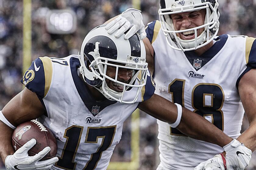 Rams receiver Robert Woods celebrates with teammate Cooper Kupp after scoring a third quarter touchdown.