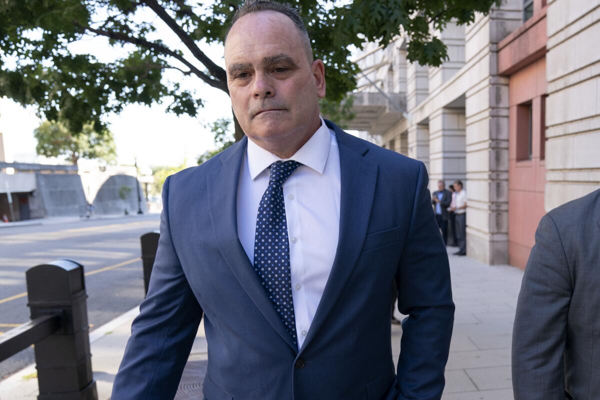 Retired New York Police Department officer Thomas Webster leaves the federal courthouse in Washington, Thursday, Sept. 1, 2022. Webster was sentenced on Thursday to 10 years in prison for attacking the U.S. Capitol and using a metal flagpole to assault one of the police officers trying to hold off a mob of Donald Trump supporters. (AP Photo/Jose Luis Magana)