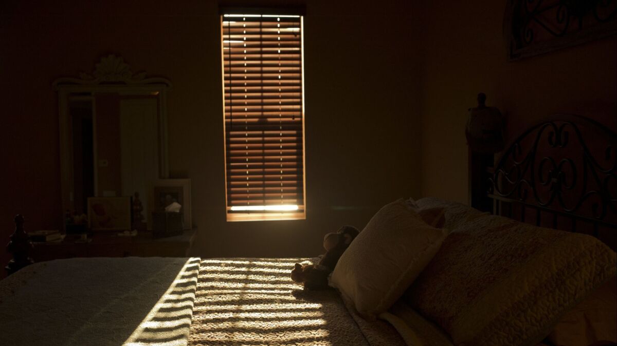 The late afternoon sunlight shines through the window of a room in La Quinta, Calif., where a person died of an opioid overdose.