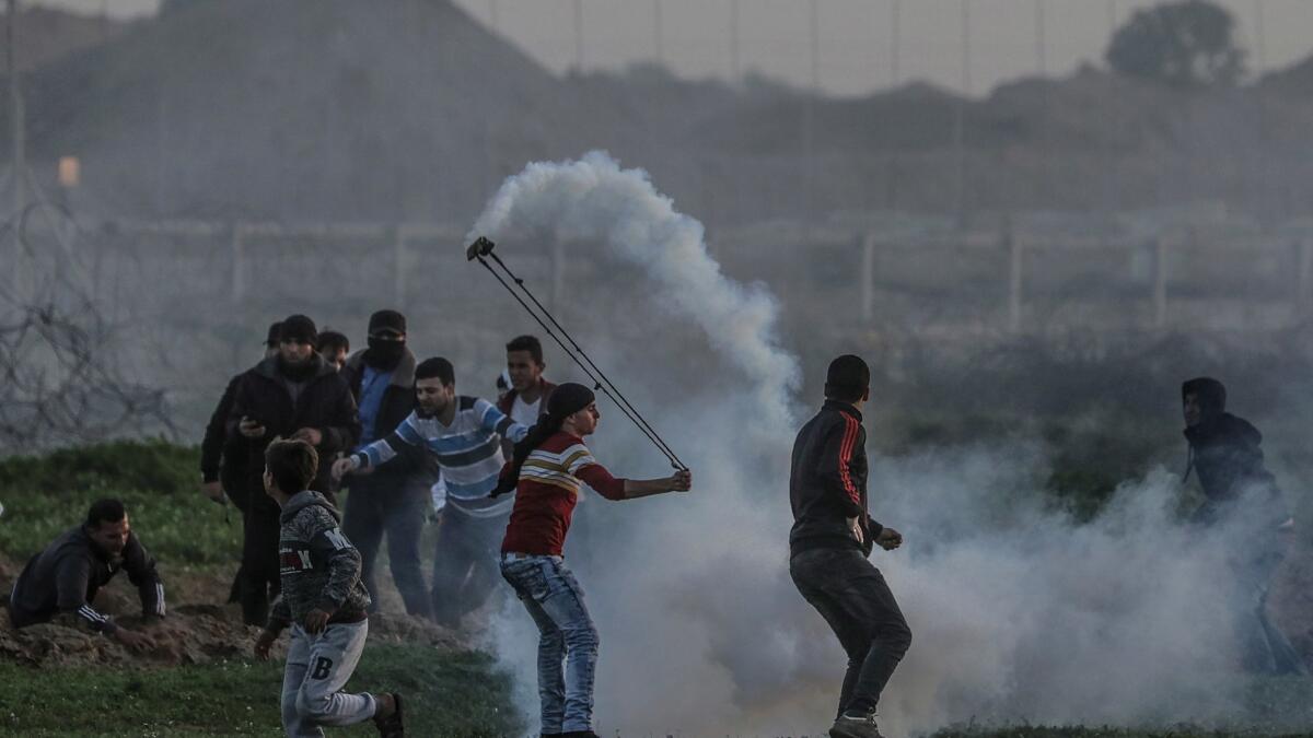Palestinians protest Friday near the border between Israel and the Gaza Strip.