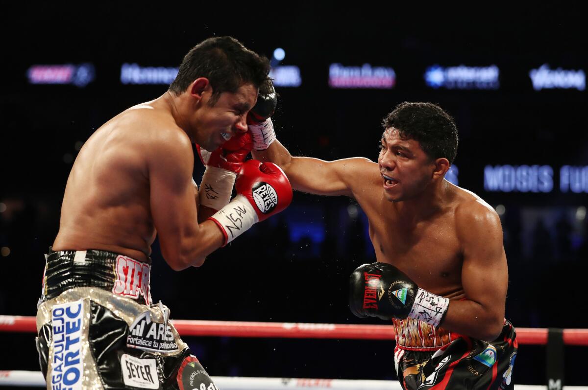 Roman Gonzalez punches Moises Fuentes during their super flyweight bout at T-Mobile Arena on September 15, 2018 in Las Vegas, Nevada.