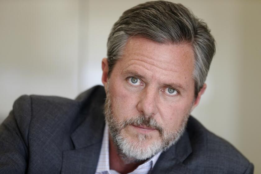 FILE - In this Nov. 16, 2016 file photo, Liberty University President Jerry Falwell Jr., pauses during an interview in his office at the school in Lynchburg, Va. On Tuesday, Aug. 25, 2020, Falwell said that he has submitted his resignation as head of evangelical Liberty University. (AP Photo/Steve Helber, File)