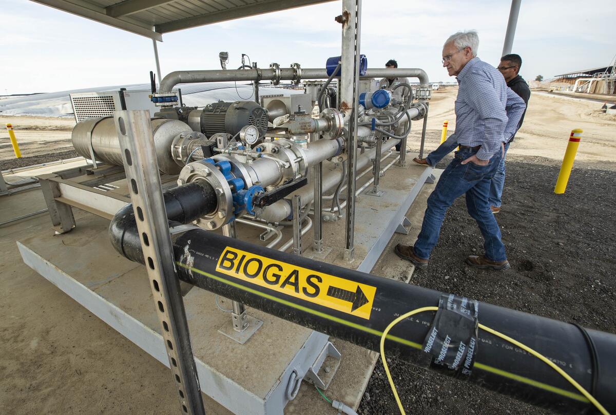 Lyle Schlyer at a dairy digester machine