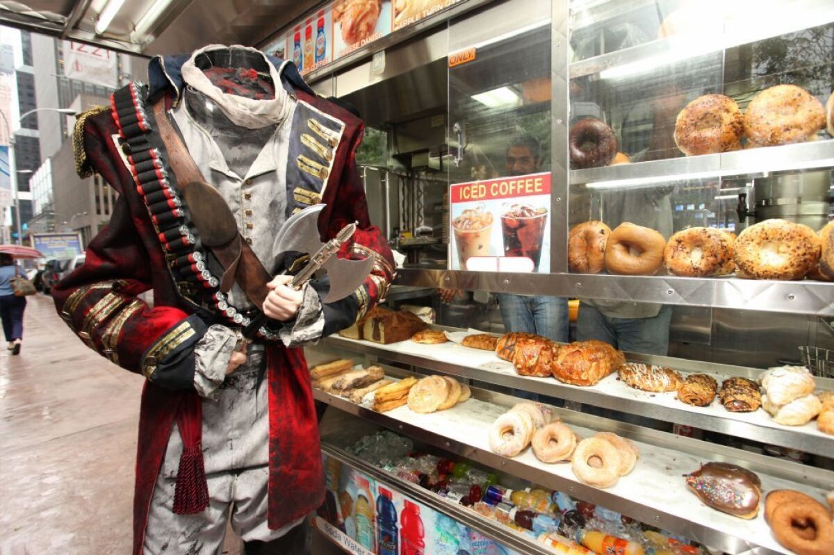 The 7-foot-tall Headless Horseman gets breakfast during FOX's "Sleepy Hollow - Fan Experience" on Monday, Sept. 16, 2013 in New York.