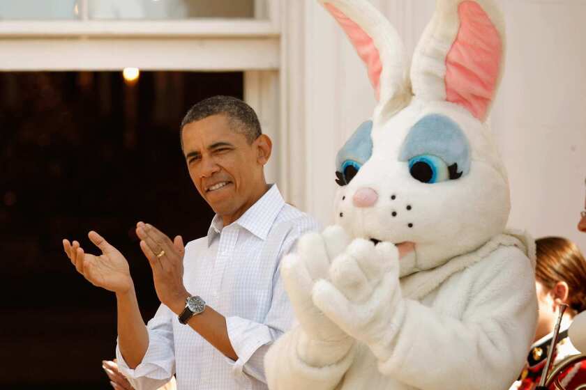 President Barack Obama gets into the action at the annual Easter Egg Roll on the South Lawn of the White House on Monday. Thousands attended the 134-year-old tradition.