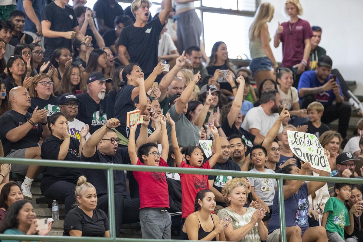 Costa Mesa fans cheer during the second meeting of the Battle for the Bell series on Tuesday.