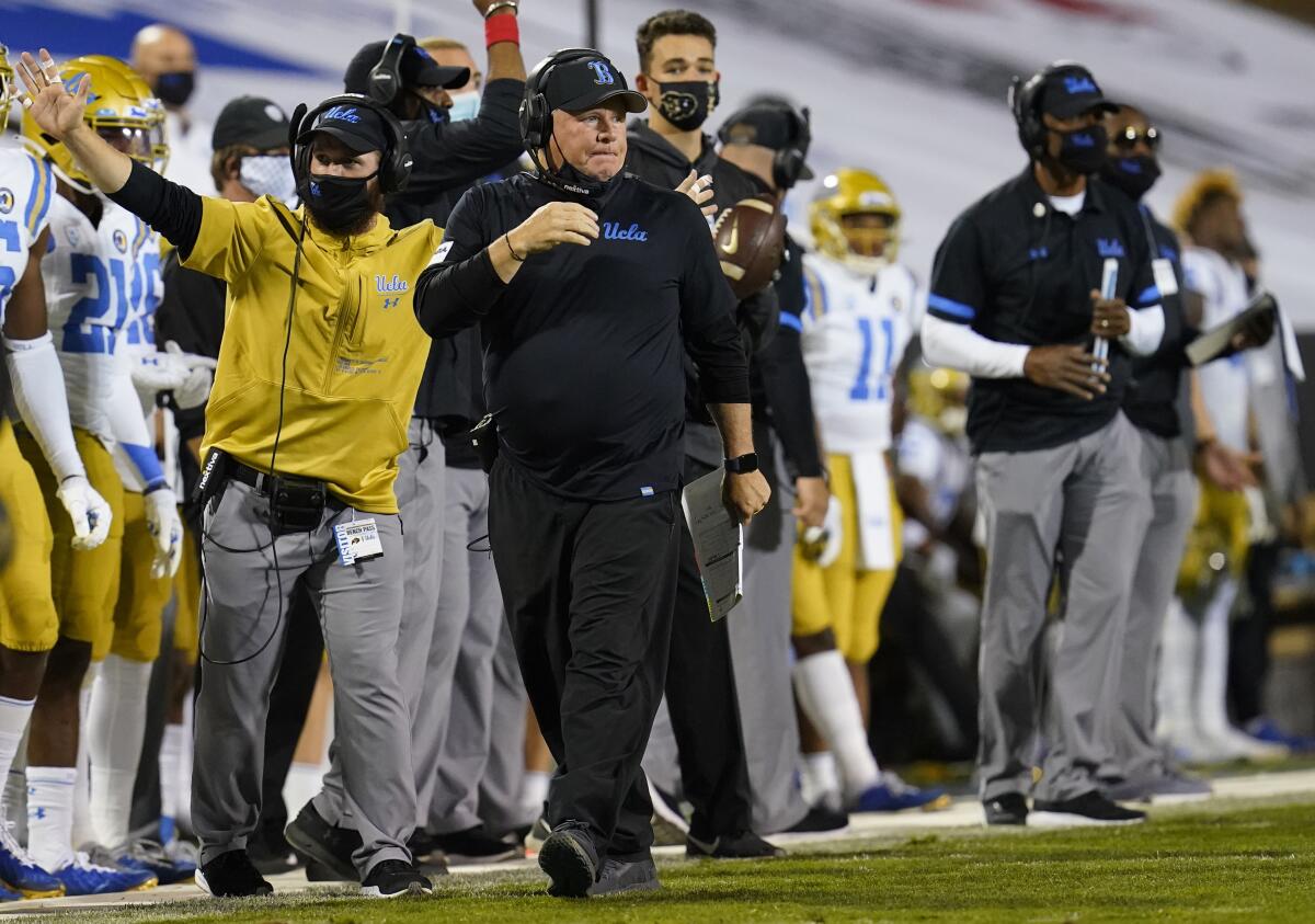 UCLA coach Chip Kelly watches before a snap against Colorado in November.