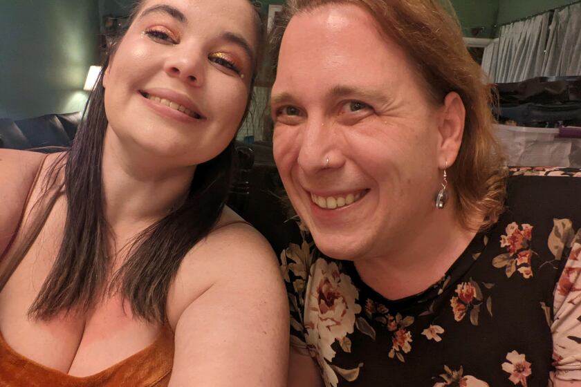 Genevieve Davis, left, taking a selfie with Amy Schneider