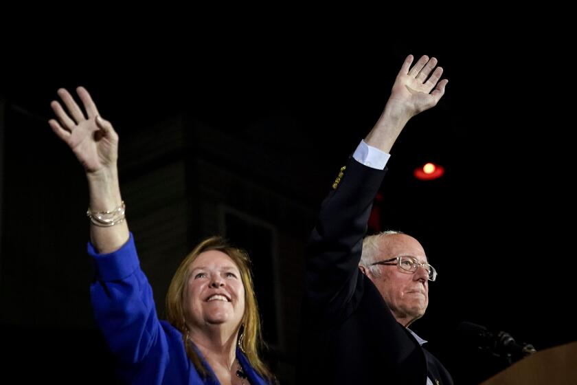 Democratic presidential candidate Sen. Bernie Sanders and his wife Jane take the stage after Sanders won the Nevada caucuses Saturday.