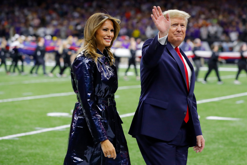 President Trump and First Lady Melania Trump walk on the field before the college football national championship game.