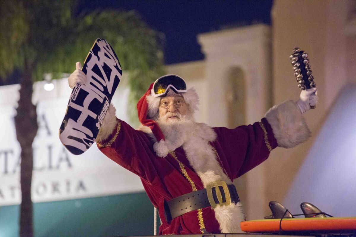 Holiday parades in San Diego North Santa with skateboard downtown Encinitas.