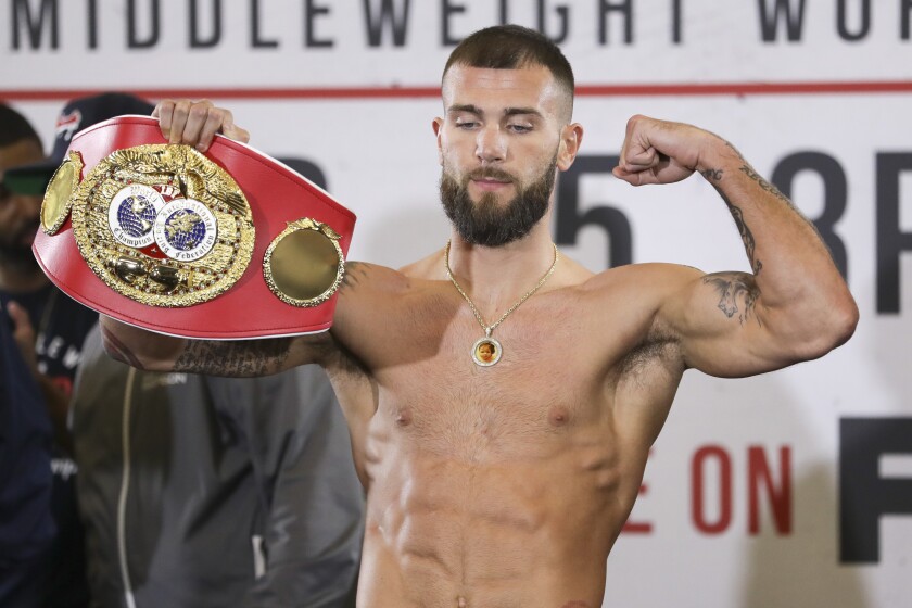 IBF super middleweight champion Caleb Plant poses during the weigh-in for his fight against Vincent Feigenbutz Friday, Feb. 14, 2020, in Nashville, Tenn. The fight is scheduled for Saturday, Feb. 15. (AP Photo/Mark Humphrey)
