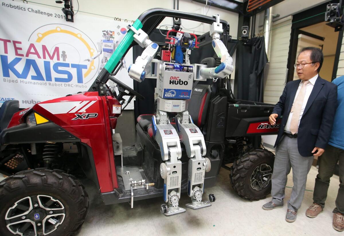 Increasingly computerized cars have left drivers potentially vulerable to hackers. Above, Hubo, a South Korean-developed humanoid robot, gets out of a jeep during an event at the June Korea Advanced Institute of Science and Technology in Daejeon, South Korea.
