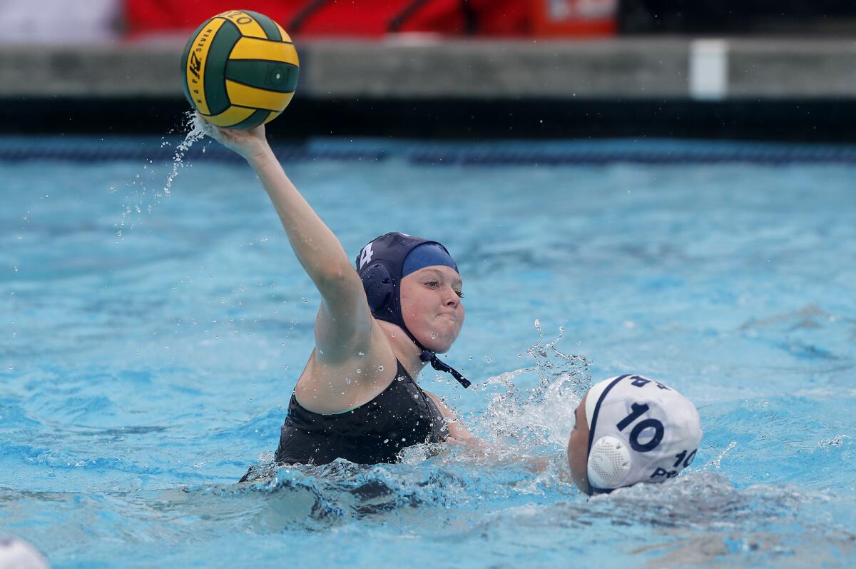 Marina's Maddison Clobes shoots over Flintridge Prep's Makena Walklett (10) during the second half in the CIF Southern Section Division 6 championship match at Woollett Aquatics Center in Irvine on Saturday.