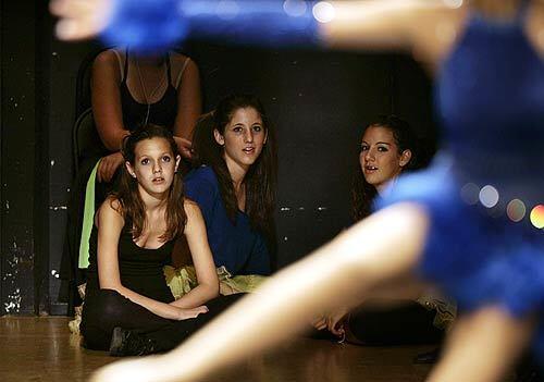 Girls watch a fellow dancer perform as they wait their turn at the Maccabi Games in Irvine.