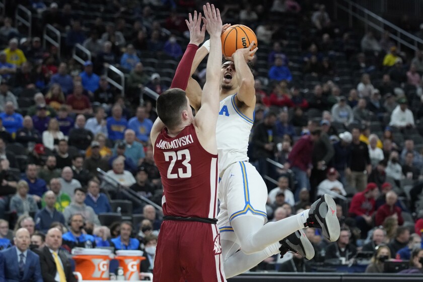 UCLA's Jules Bernard shoots over Washington State's Andrej Jakimovski.