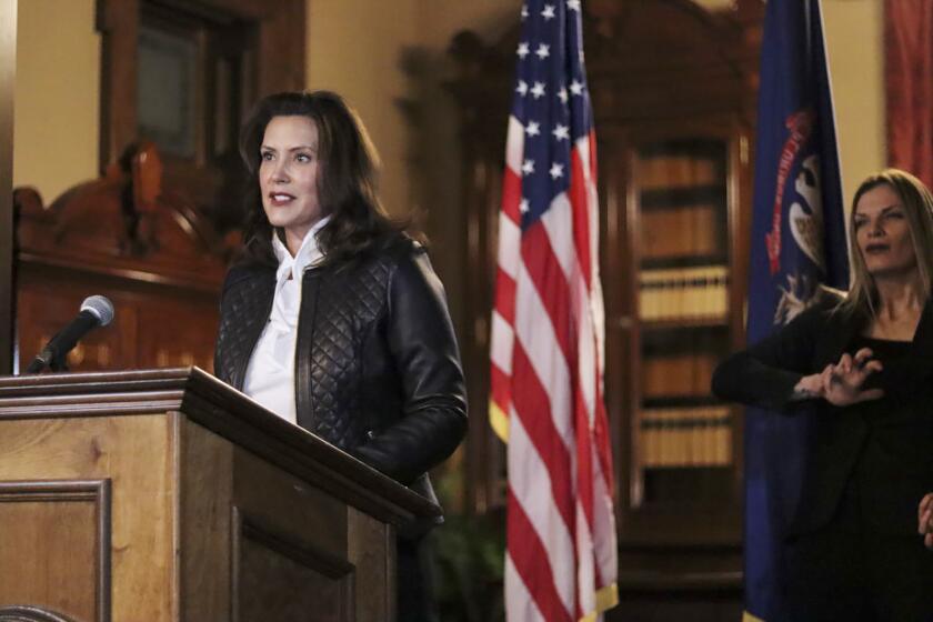 FILE - In this Oct. 8, 2020 file photo provided by the Michigan Office of the Governor, Michigan Gov. Gretchen Whitmer addresses the state during a speech in Lansing, Mich. In an indictment released Thursday, Dec. 17, a federal grand jury charged six men with conspiring to kidnap Whitmer in what investigators say was a plot by anti-government extremists angry over her policies to prevent the spread of the coronavirus. (Michigan Office of the Governor via AP, File)