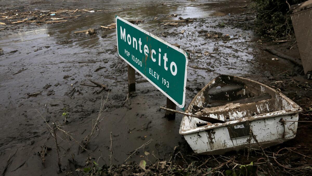 Less than a year after mud and debris flows devastated Montecito, officials are warning that recent wildfires have increased the risk of flooding. Here, mud and debris obscures Highway 101 in Montecito in January.