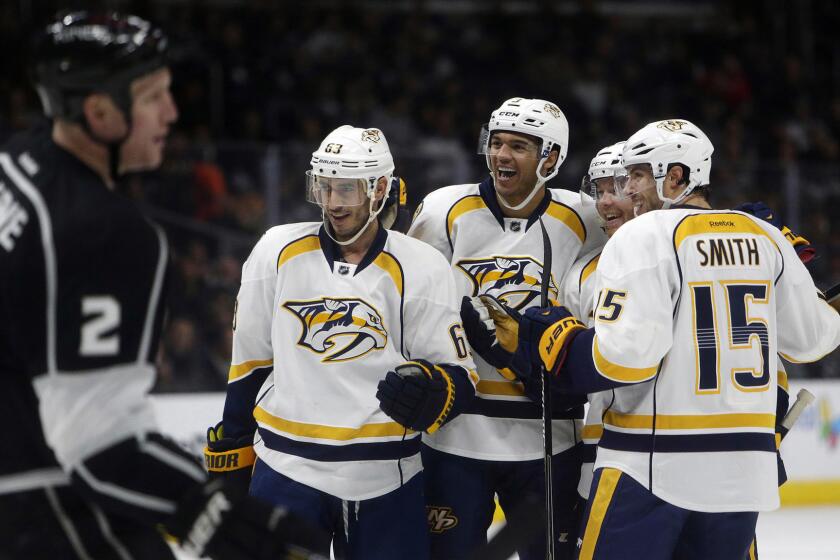 Nashville Predators defenseman Ryan Ellis, second right, celebrates with his teammates after scoring during the first period of a 7-6 overtime win over the Kings at Staples Center on Saturday.