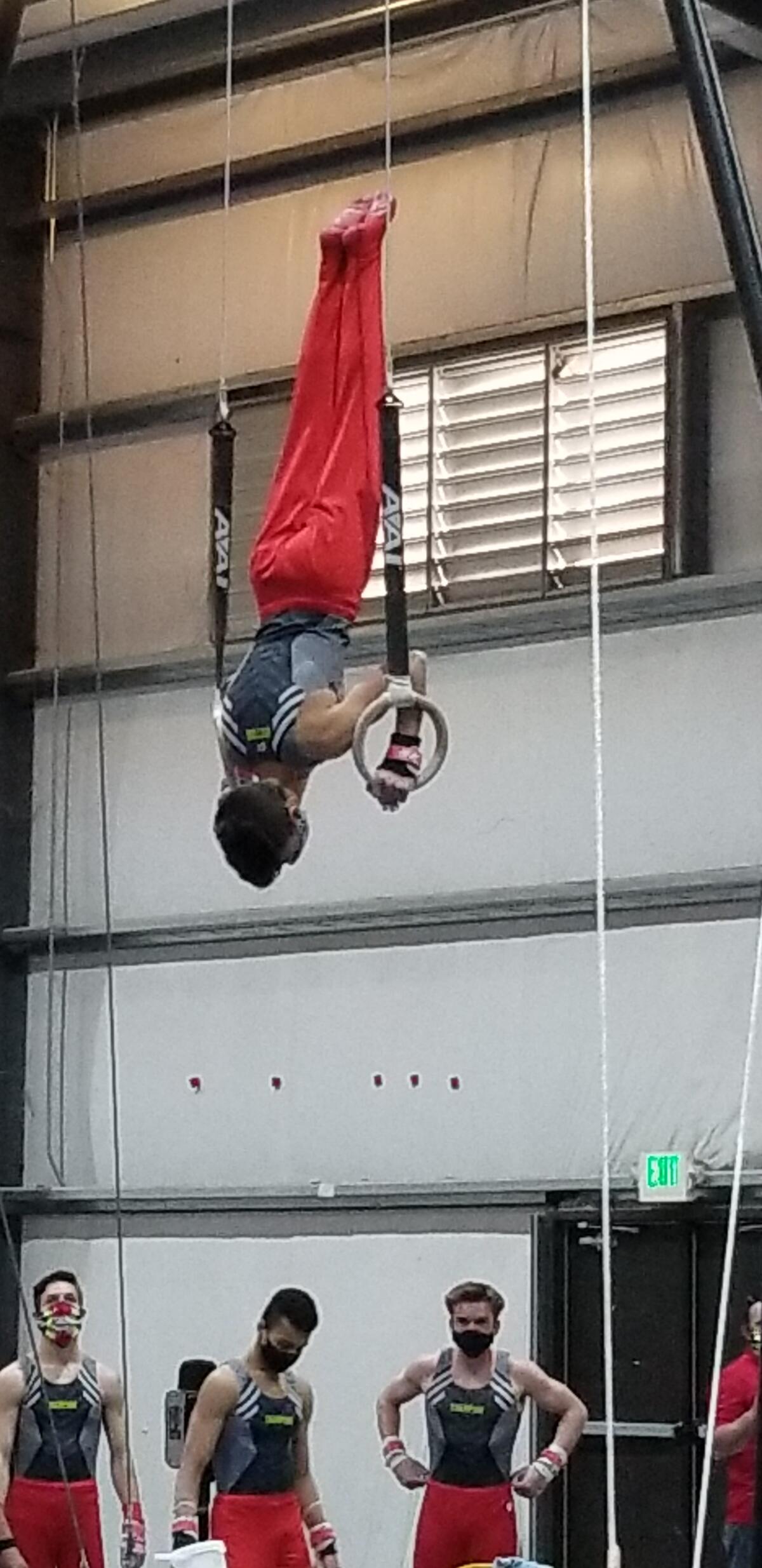 Bishop's School freshman Victor Joulin-Batejat completes the rings event at a recent competition.