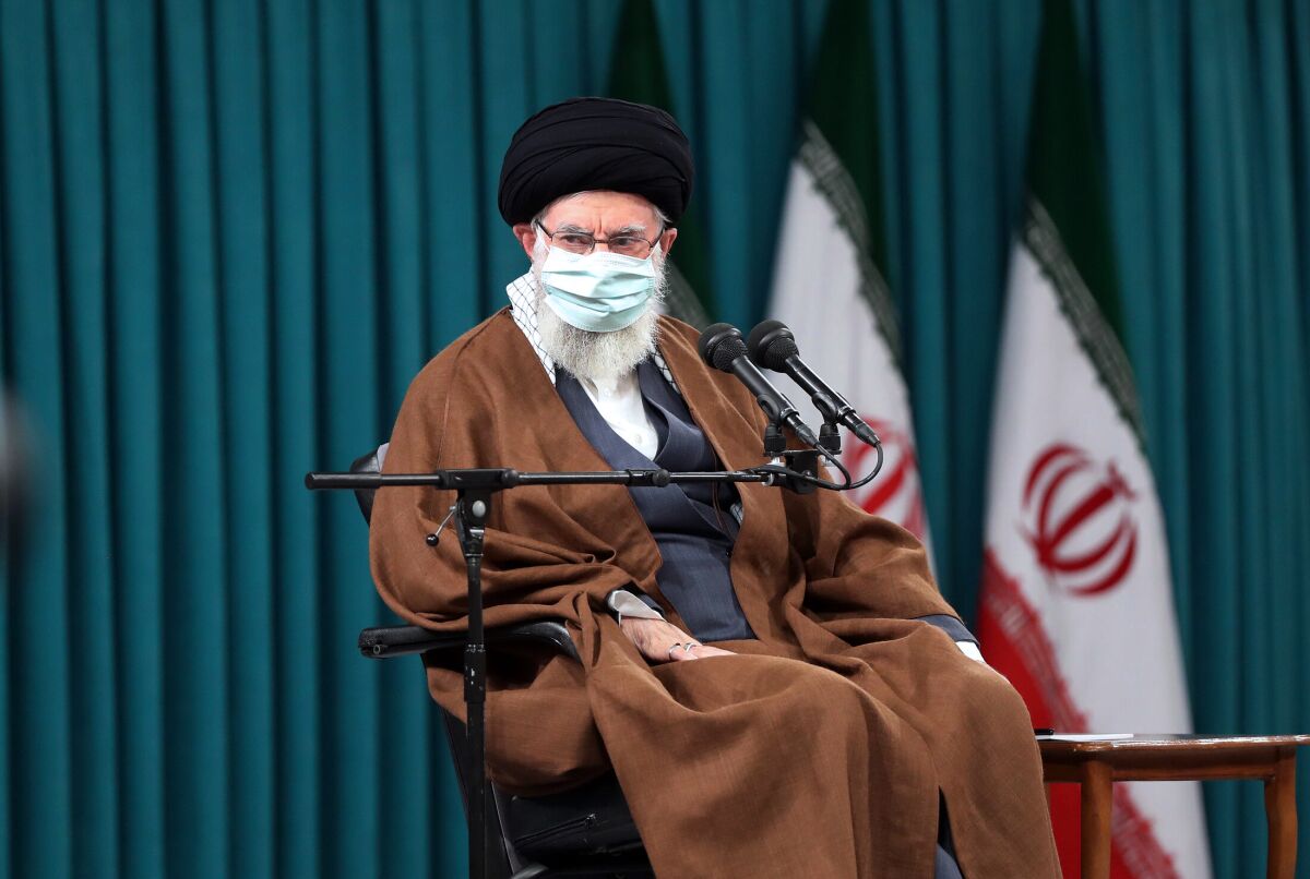 In this picture released by the official website of the office of the Iranian supreme leader, Supreme Leader Ayatollah Ali Khamenei attends a meeting with the country's top officials in Tehran, Iran, Tuesday, April 12, 2022. Iran's supreme leader on Tuesday insisted negotiations over Tehran's tattered nuclear deal “are going ahead properly,” even after repeated comments by American officials that an agreement to restore the accord may not happen. (Office of the Iranian Supreme Leader via AP)